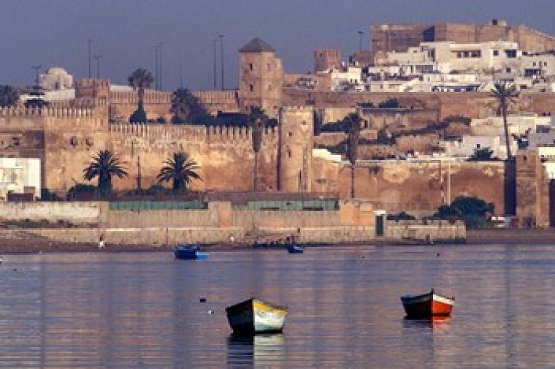 Fishing Boats with 17th century Kasbah des Oudaias Morocco Canvas Art - John & Lisa Merrill DanitaDelimont (36 x 24)