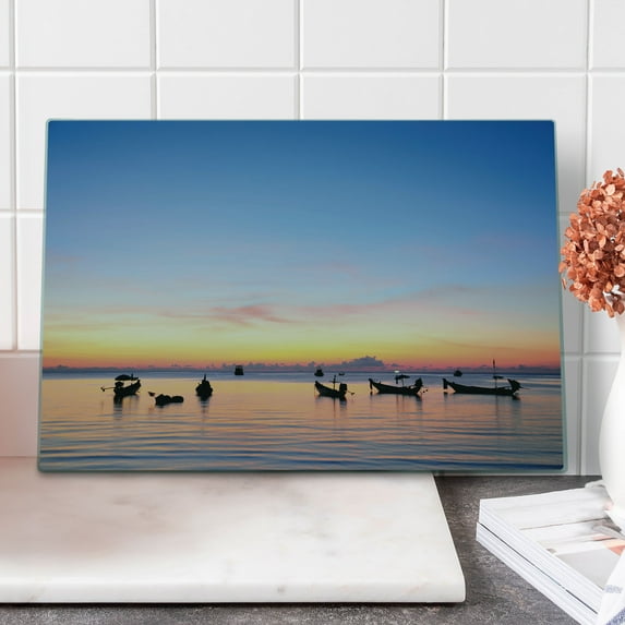 Fishing Cutting Board, Sunset on Sea with Silhouette Ships at Suratthani Bay Relaxation Art, Decorative Tempered Glass Cutting and Serving Board, Large Size, Blue Yellow Coral, by Ambesonne