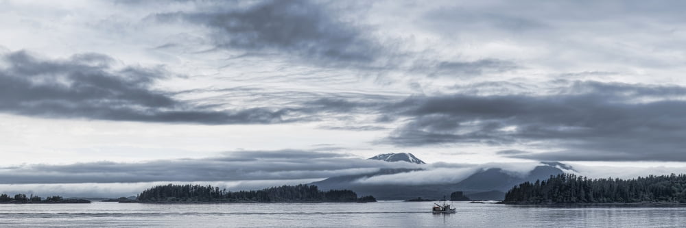 Fishing boat in ocean with Reddit Volcano in the background Sitka Southeast Alaska Alaska USA Canvas Art - Panoramic Images (27 x 9)