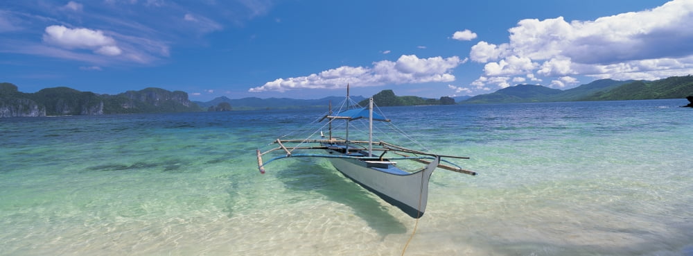 Fishing boat moored on the beach Palawan Philippines Canvas Art - Panoramic Images (27 x 9)