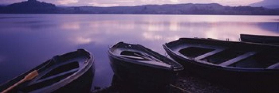 Fishing boats moored in a lake Loch Awe Strathclyde Region Highlands Region Scotland Canvas Art - Panoramic Images (18 x 6)