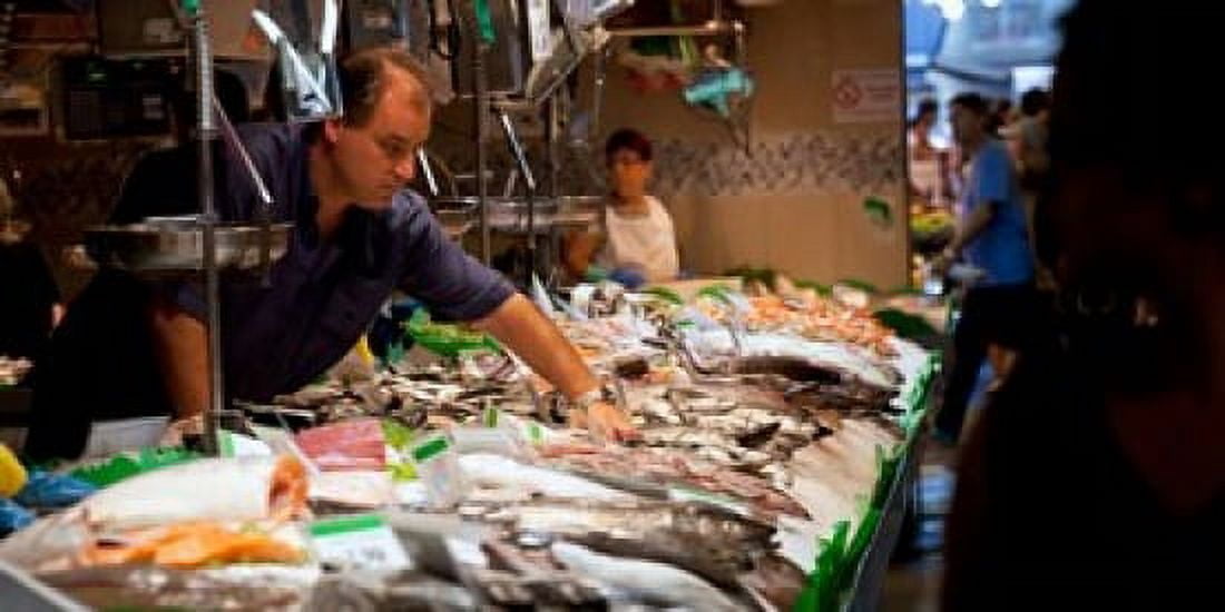 Fishmonger at a fish stall La Boqueria Market Ciutat Vella Barcelona Catalonia Spain Canvas Art - Panoramic Images (24 x 12)