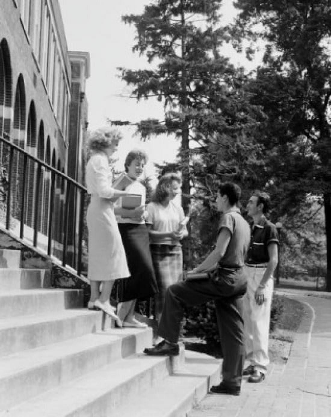 Five students standing on steps in front of university building and talking Canvas Art - (18 x 24)