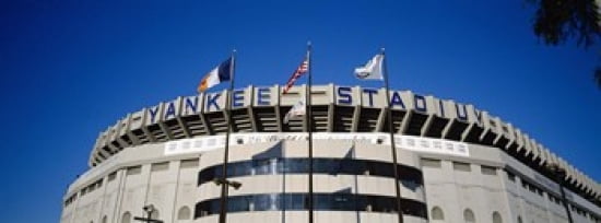 Flags in front of a stadium Yankee Stadium New York City New York USA Canvas Art - Panoramic Images (30 x 12)