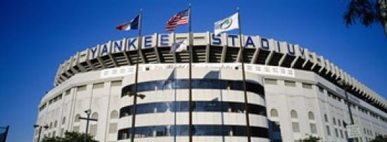 Flags in front of a stadium Yankee Stadium New York City New York USA Canvas Art - Panoramic Images (36 x 13)
