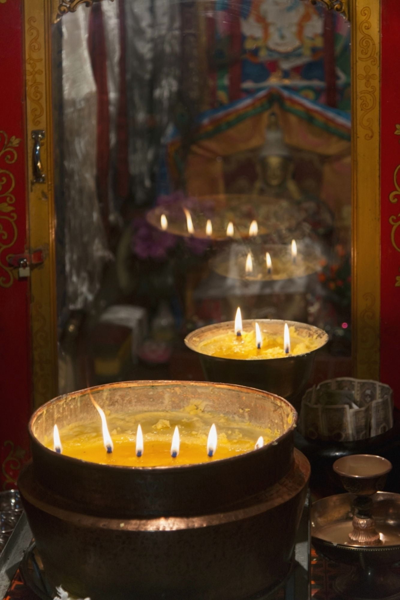 Flames burning in a row in large bronze potsLhasa xizang china Canvas Art - Keith Levit Design Pics (12 x 18)