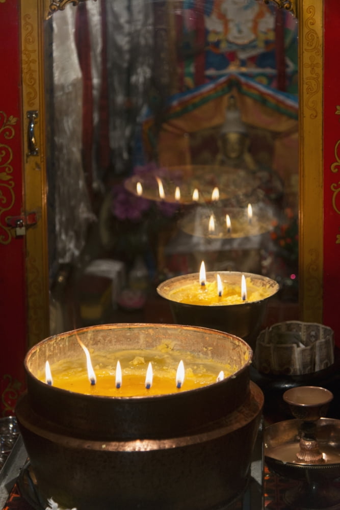 Flames burning in a row in large bronze potsLhasa xizang china Canvas Art - Keith Levit Design Pics (24 x 36)