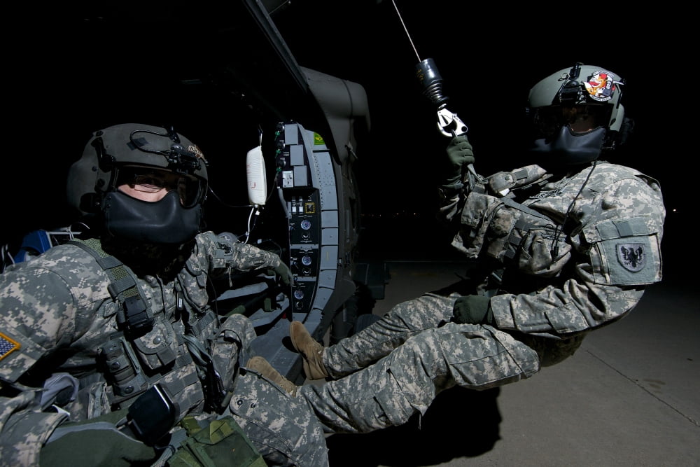 Flight medics practice with the UH-60 Blackhawk hoist Canvas Art - Terry MooreStocktrek Images (18 x 12)