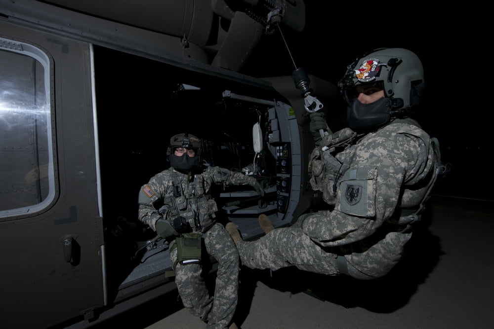 Flight medics practice with the UH-60 Blackhawk hoist Canvas Art - Terry MooreStocktrek Images (35 x 23)