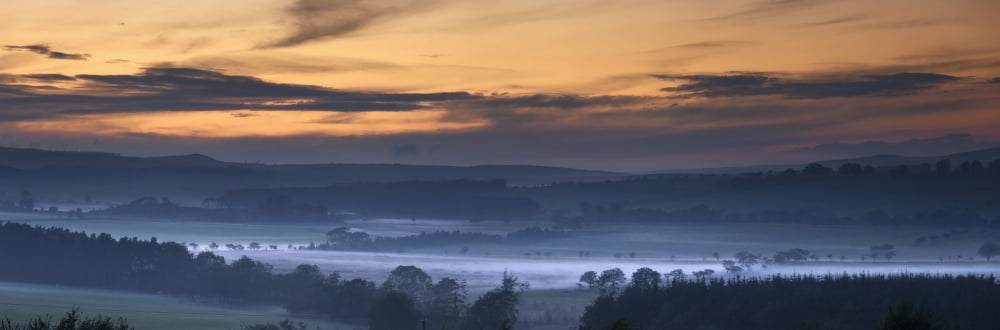 Fog Lies Over A Town At Sunset Swarland Northumberland England Canvas Art - John Short Design Pics (44 x 15)