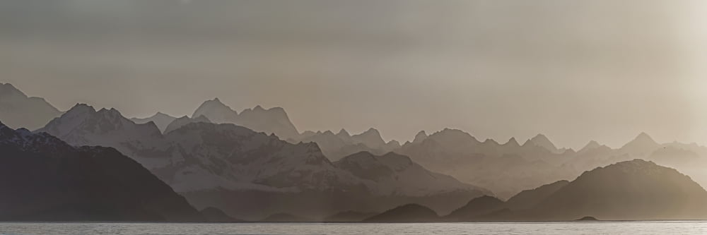 Fog over mountain in Glacier Bay National Park Southeast Alaska Alaska USA Canvas Art - Panoramic Images (27 x 9)