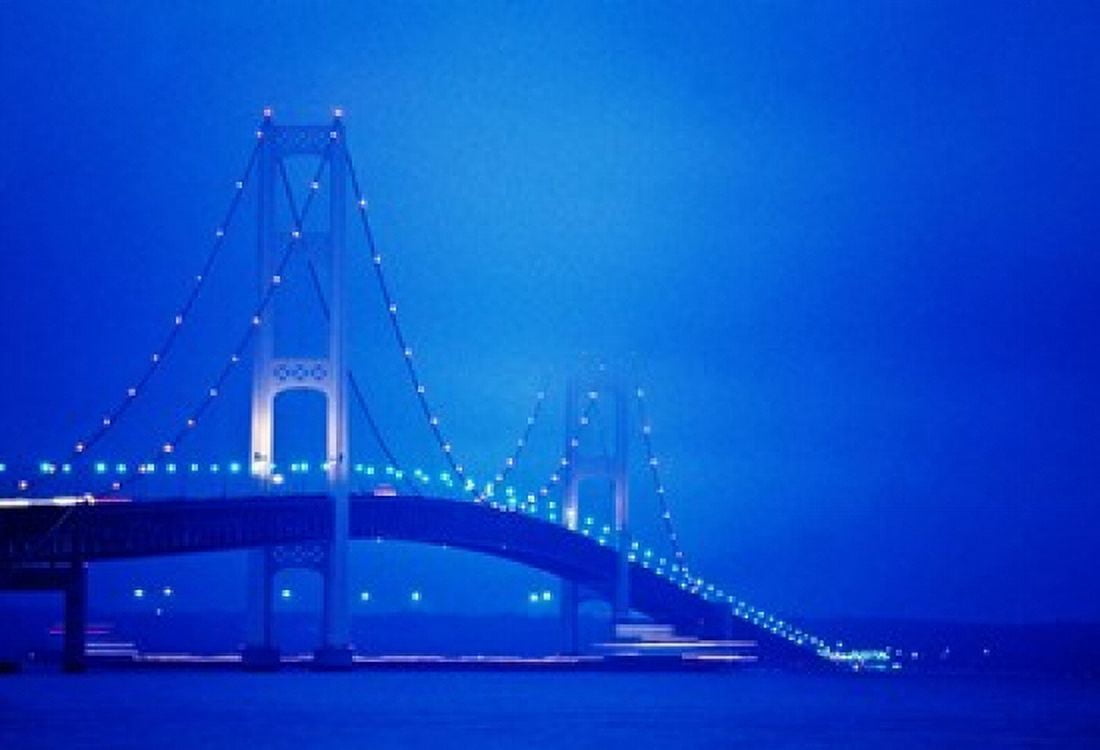 Fog surrounding the Mackinac Bridge at dusk Michigan USA Canvas Art - Panoramic Images (36 x 25)
