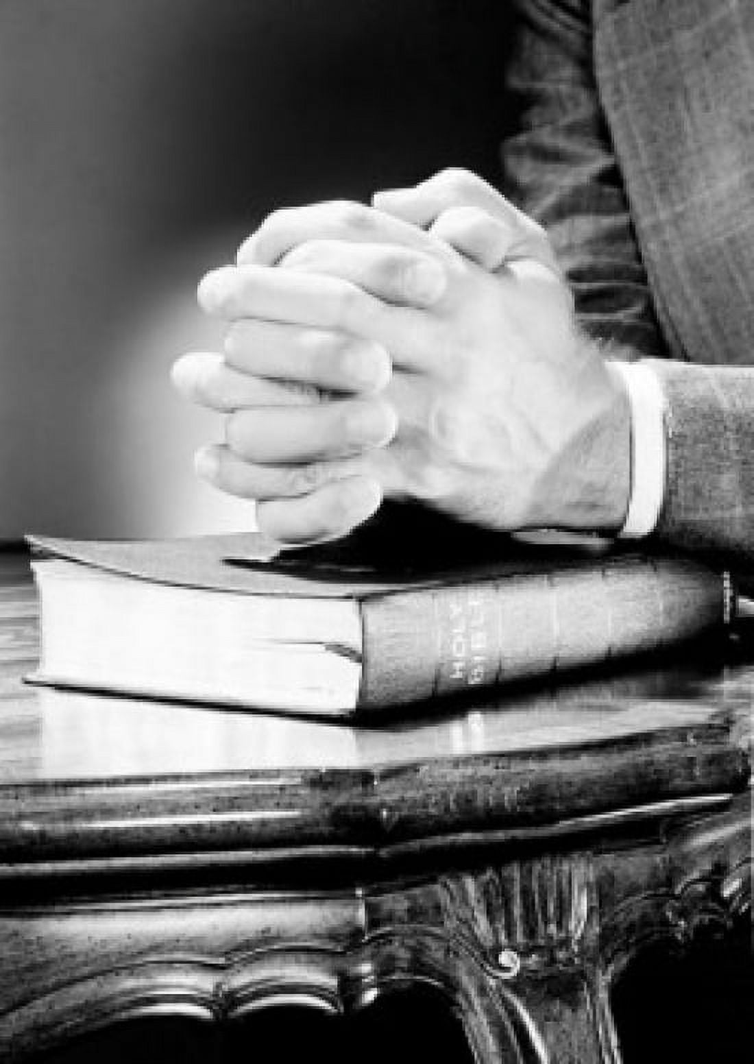 Folded hands on top of Bible Canvas Art - (18 x 24)
