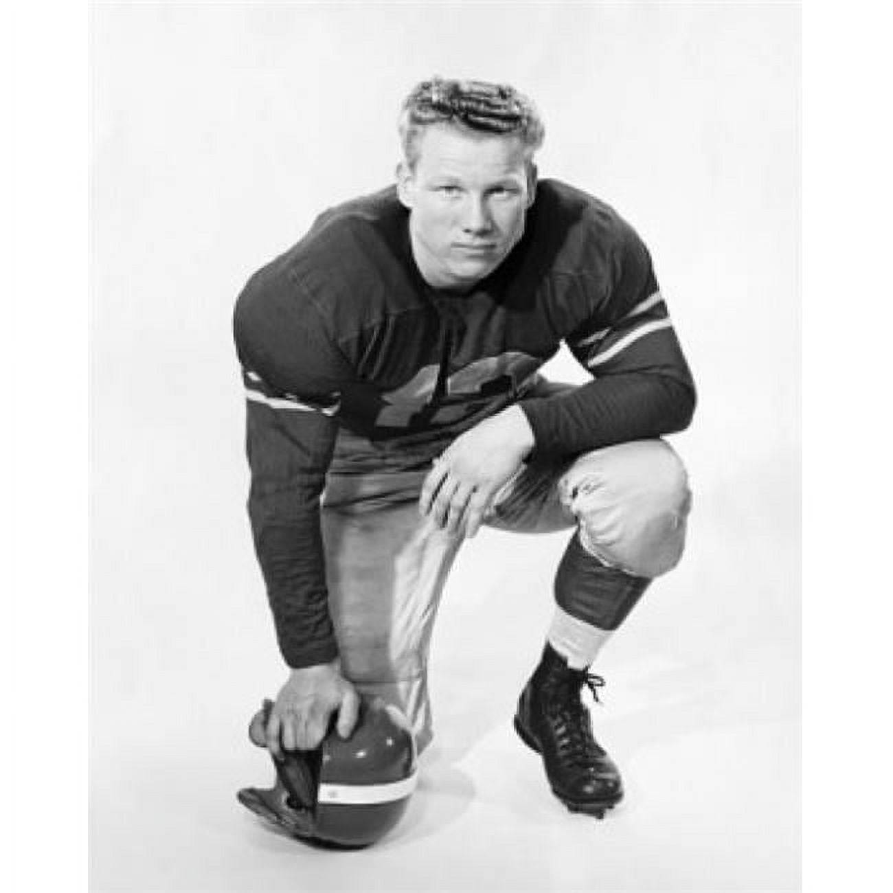 Football Player Kneeling & Holding A Football Helmet Poster Print, 18 x