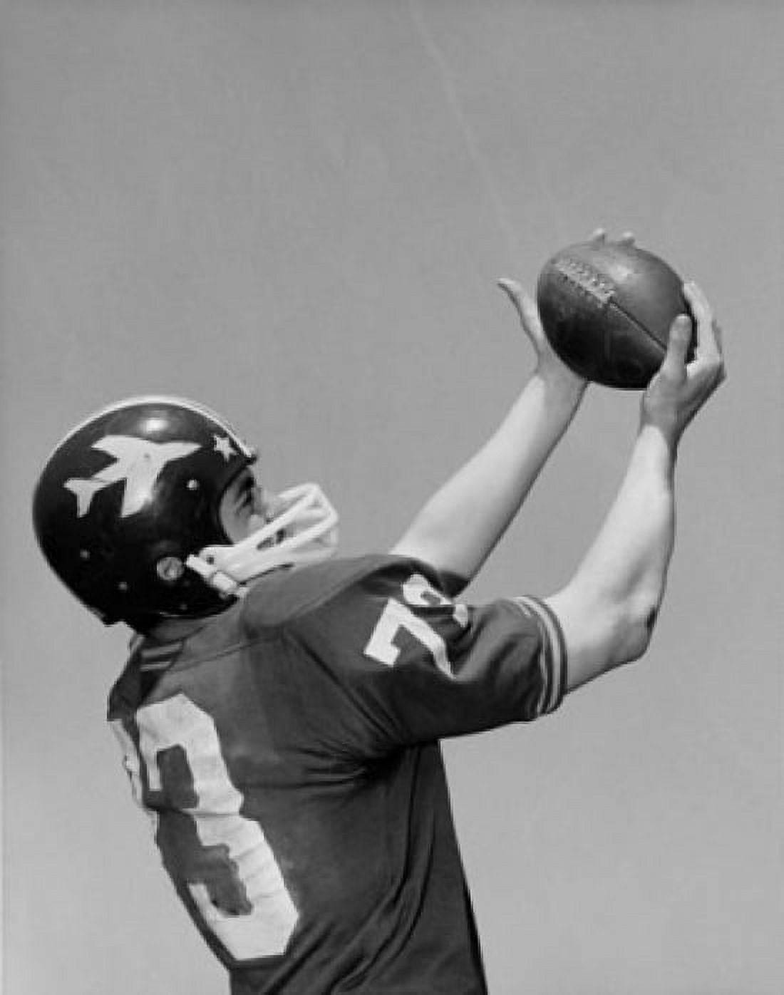 Football player catching football Canvas Art - (24 x 36)