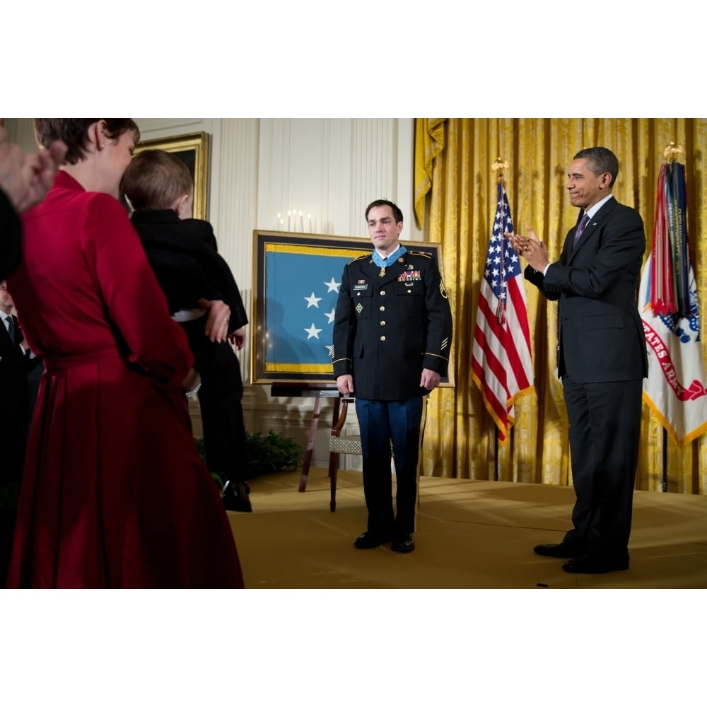 Former Staff Sergeant Clinton Romesha Receives The Medal Of Honor At The White House. President Obama Applauds At Right.