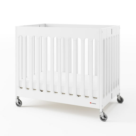 Foundations Boutique Compact Folding Hotel Crib with 3" Mattress and Locking Wheels, White