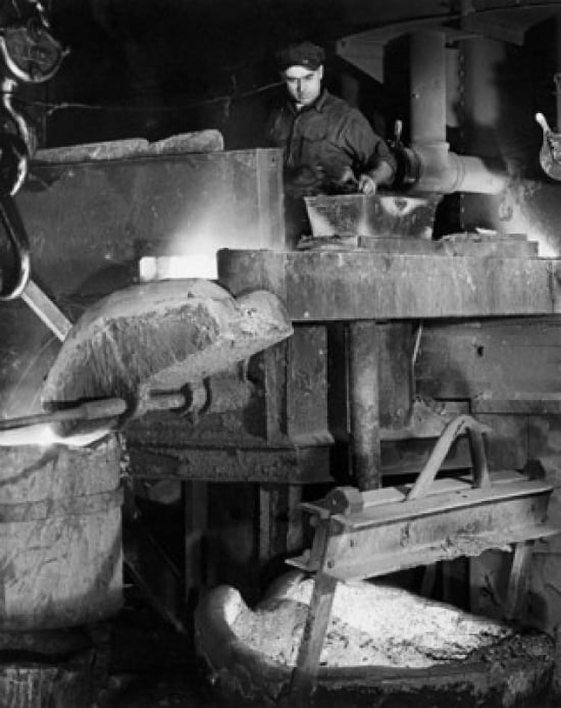 Foundry worker pouring molten steel in a container Canvas Art - (24 x 36)