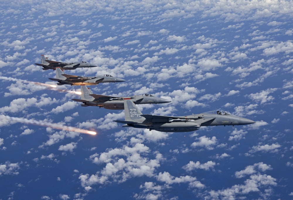 Four F-15 Eagles fly in formation over the Pacific Ocean Canvas Art - HIGH-G ProductionsStocktrek Images (18 x 12)