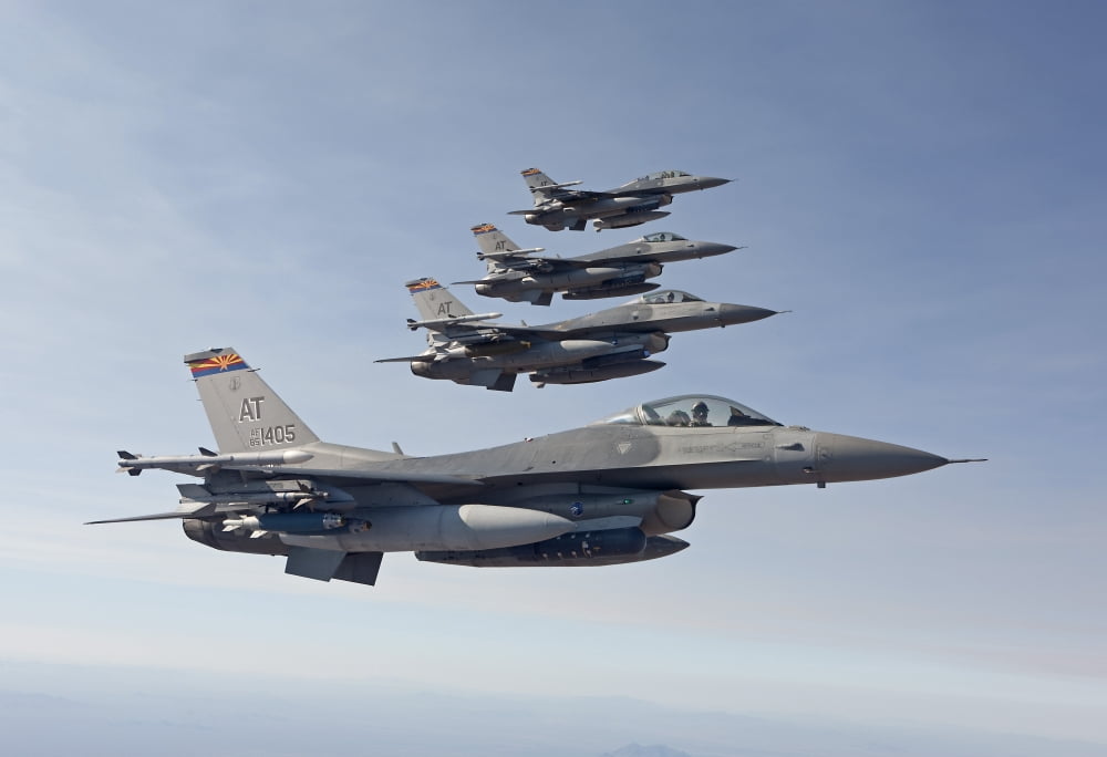 Four F-16s fly in formation over Arizona Canvas Art - HIGH-G ProductionsStocktrek Images (35 x 24)