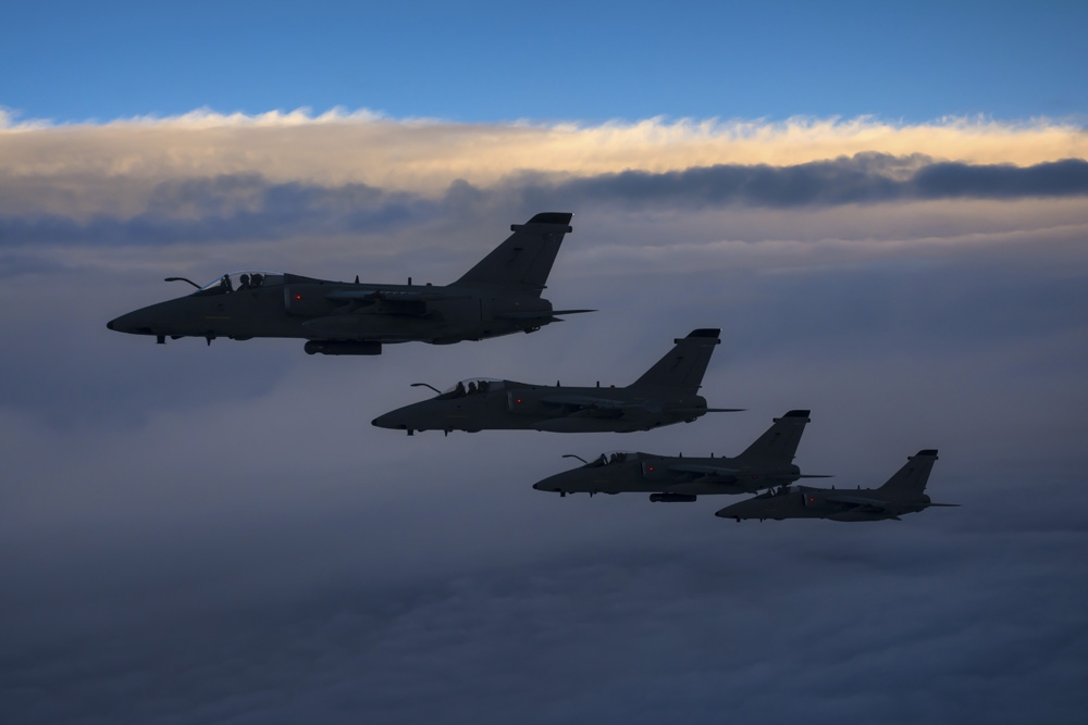 Four Italian Air Force AMX aircraft flying over the Tyrrhenian Sea Canvas Art - Daniele FaccioliStocktrek Images (17 x 12)
