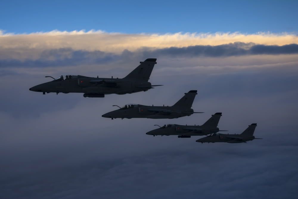 Four Italian Air Force AMX aircraft flying over the Tyrrhenian Sea Canvas Art - Daniele FaccioliStocktrek Images (34 x 23)