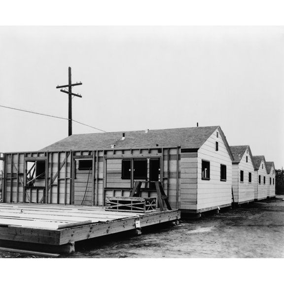 Four Small Completed Mobile Homes With Another Partially Built. Built By Mobilhome Corporation Of California In The