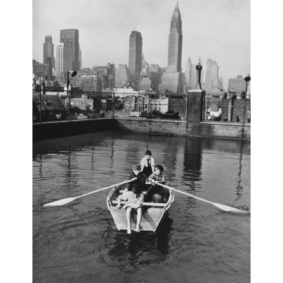 Four Young Members Of The Madison Square Boy'S Club Rowing A Boat In A Rooftop Pool. Manhattan Skyscrapers Are In The