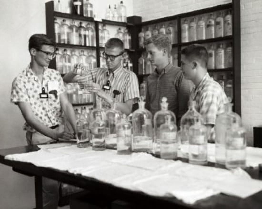 Four boys performing an experiment in a chemistry laboratory Canvas Art - (24 x 36)