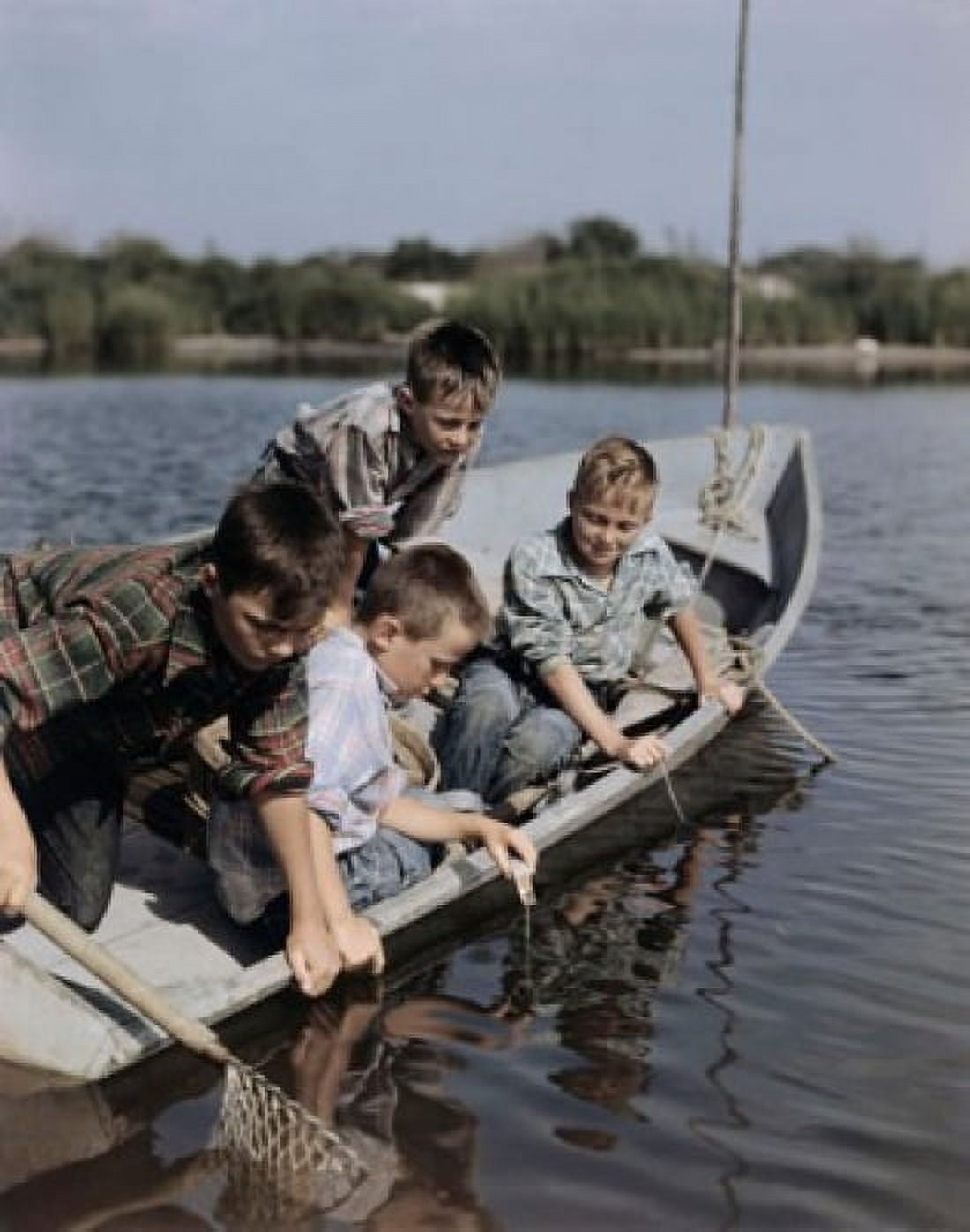 Four boys sitting in a boat and fishing Canvas Art - (18 x 24)