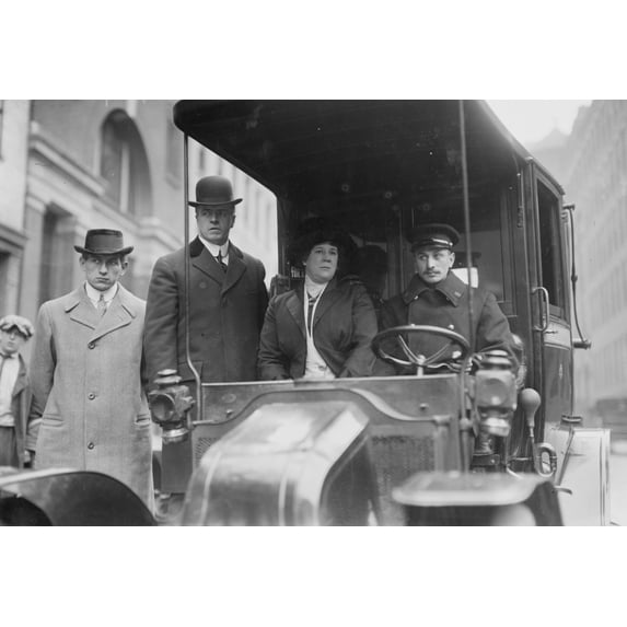 Four dour people one of whom is their driver look posed while seated in their taxi Poster Print