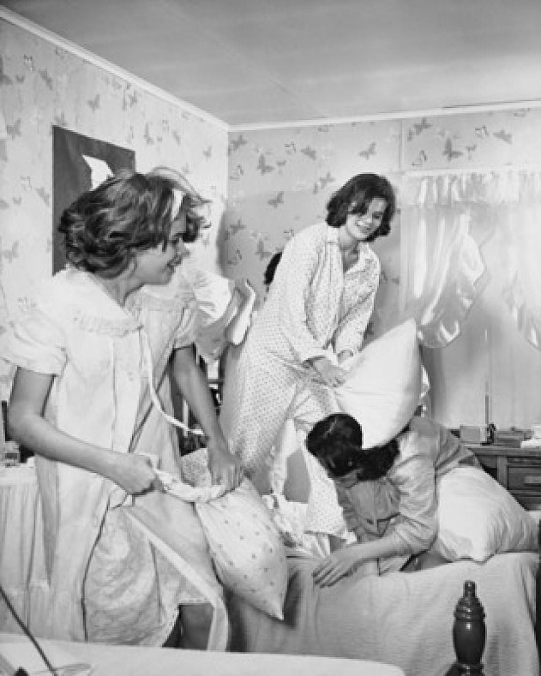 Four teenage girls having a pillow fight Canvas Art - (18 x 24)