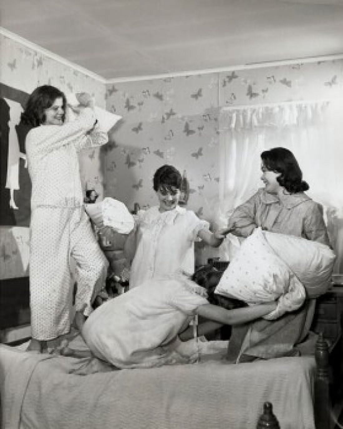 Four teenage girls having a pillow fight Canvas Art - (24 x 36)