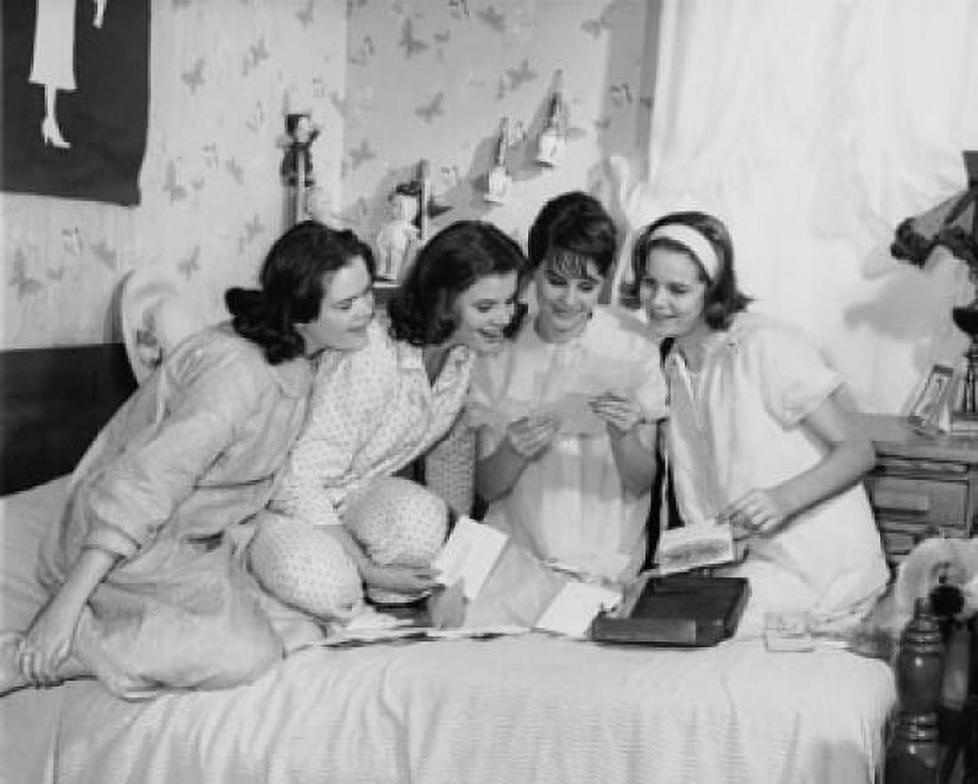 Four teenage girls reading a letter Canvas Art - (18 x 24)