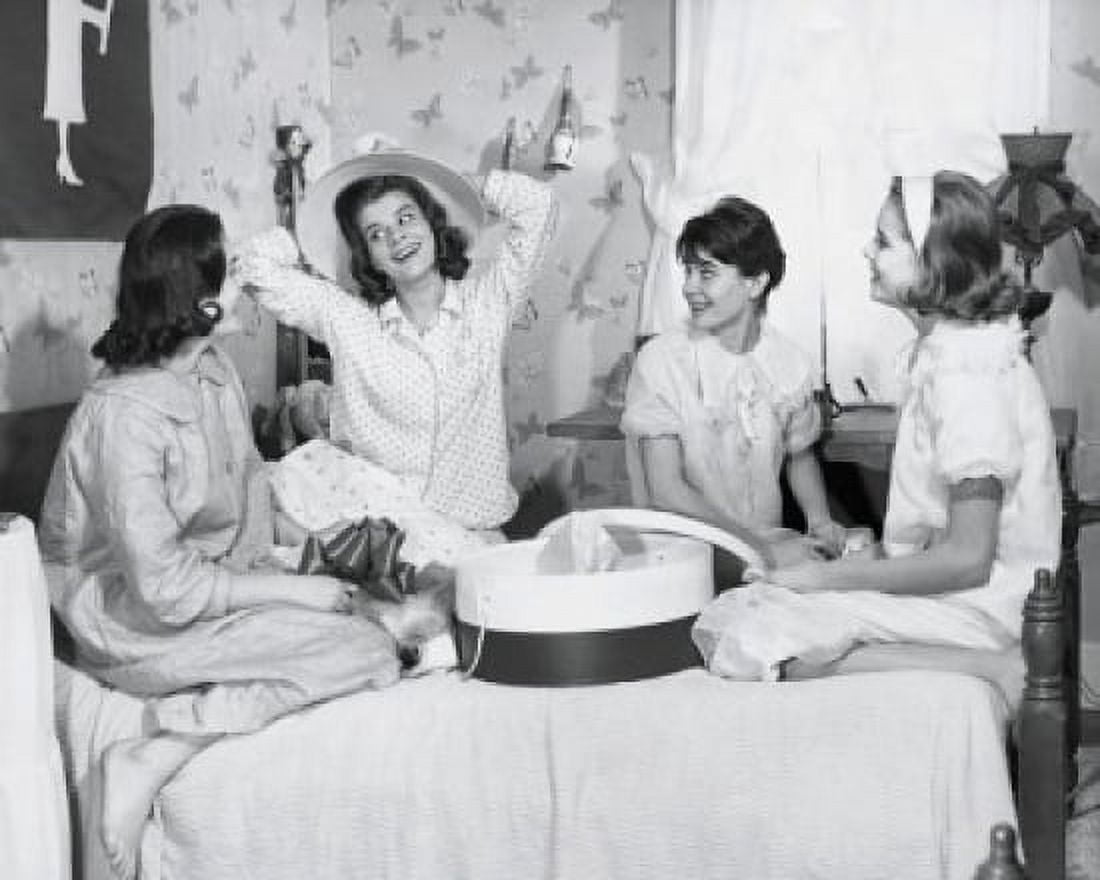 Four teenage girls sitting on a bed together Canvas Art - (24 x 36)