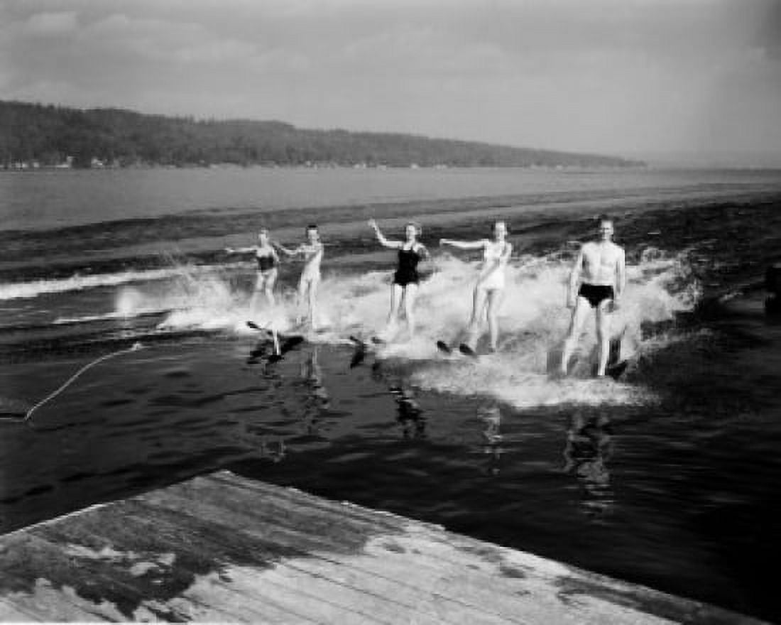 Four women and man waterskiing Canvas Art - (24 x 36)