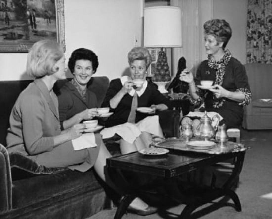 Four young women sitting together drinking tea Canvas Art - (24 x 36)