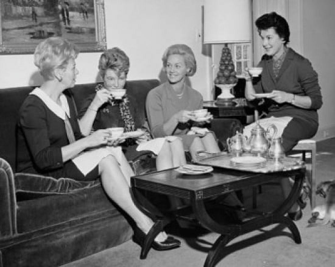 Four young women sitting together drinking tea Canvas Art - (24 x 36)