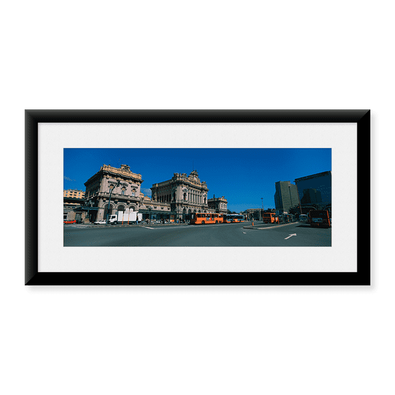 Framed Art Print, Bus parked in front of a railroad station by Panoramic Images, 31-7/8" x 11-7/8"