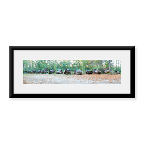 Framed Art Print, Old rusty cars and trucks in a field by Panoramic Images, 25-7/8" x 9-7/8"
