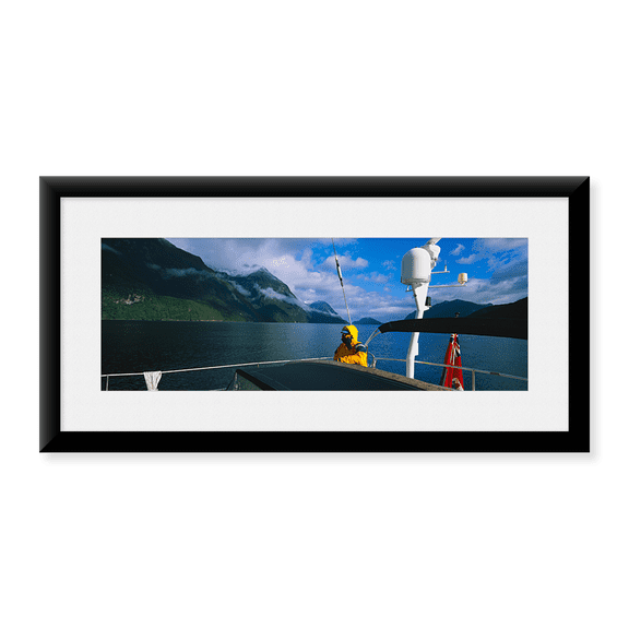 Framed Art Print, Sailor on a yacht by Panoramic Images, 25-7/8" x 9-7/8"