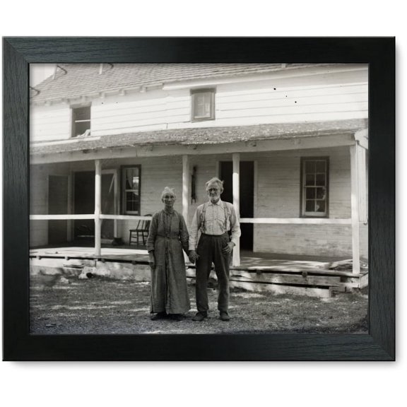 Framed Print: Captain Tate And Wife Standing In Front Of The Kitty Hawk Post