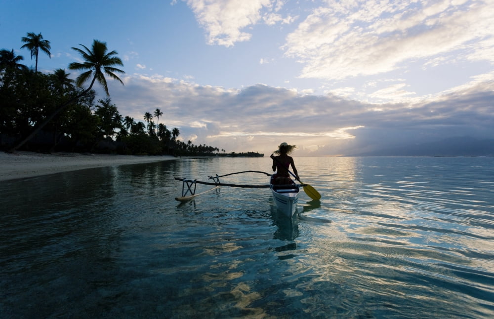 French Polynesia Moorea Woman Paddling In Outrigger Canoe Along Shoreline Canvas Art - M Swiet Productions Design Pics (34 x 22)