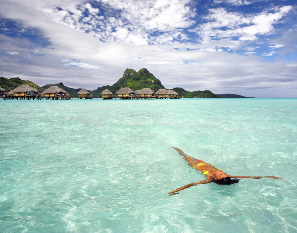 French Polynesia Tahiti Bora Bora Woman Floating In Water Near Resort Canvas Art - M Swiet Productions Design Pics (34 x 26)