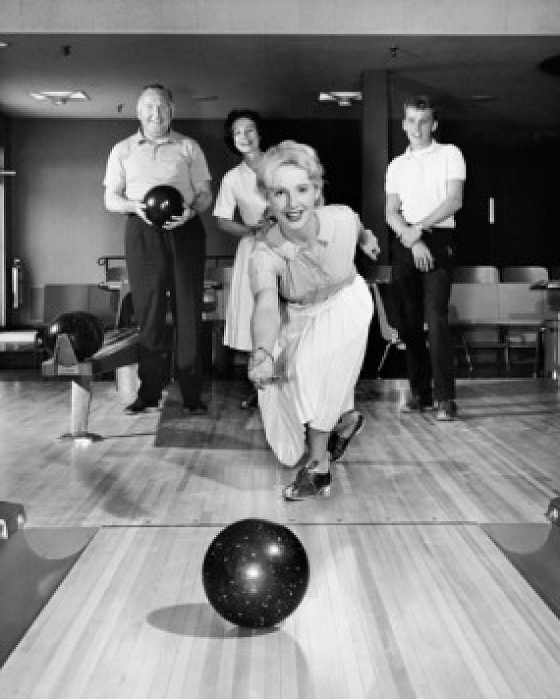 Front view of a family bowling Canvas Art -  (18 x 24)