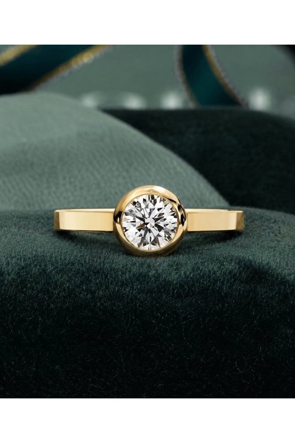0.64 CT Round Cut Lab Grown Diamond Bezel Set Solitaire Engagement Ring In Yellow Gold