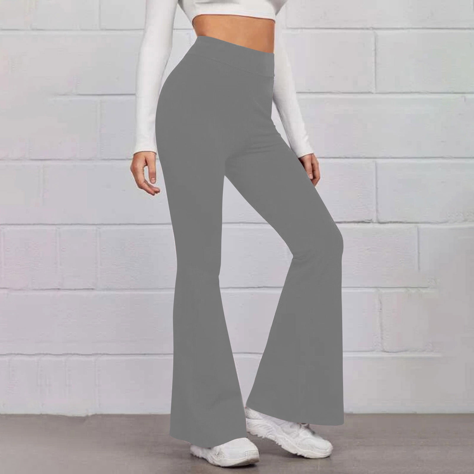 Dark grey sports flare pants with slit for women, ankle length gym pants.