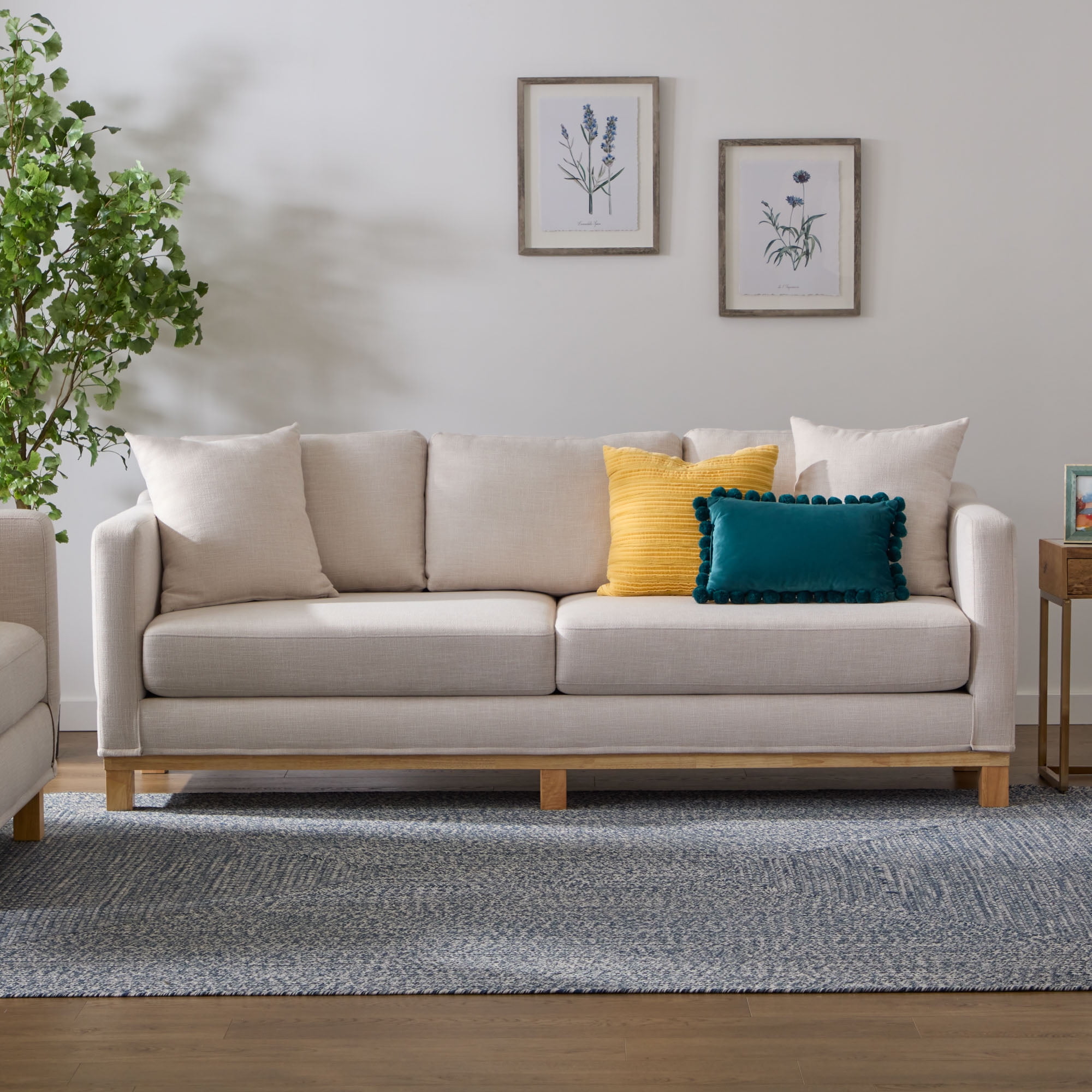 Sofa with outlet wood trim base