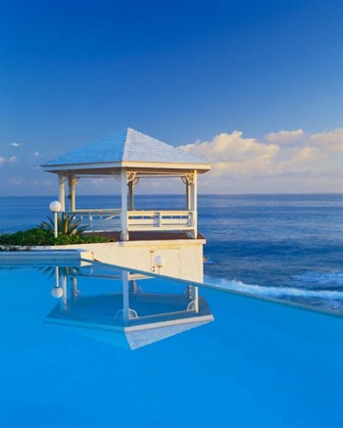 Gazebo reflecting on pool with sea in background Long Island Bahamas Canvas Art - Kent Foster DanitaDelimont (25 x 30)
