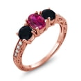thumbnail image 1 of Gem Stone King 1.92 Ct Oval Red Created Ruby Black Onyx 18K Rose Gold Plated Silver Moissanite Ring (Size 9), 1 of 4